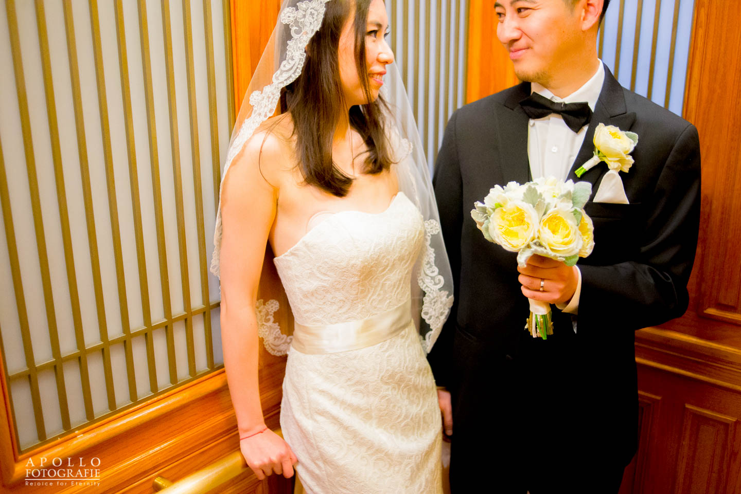 bride and groom in elevator