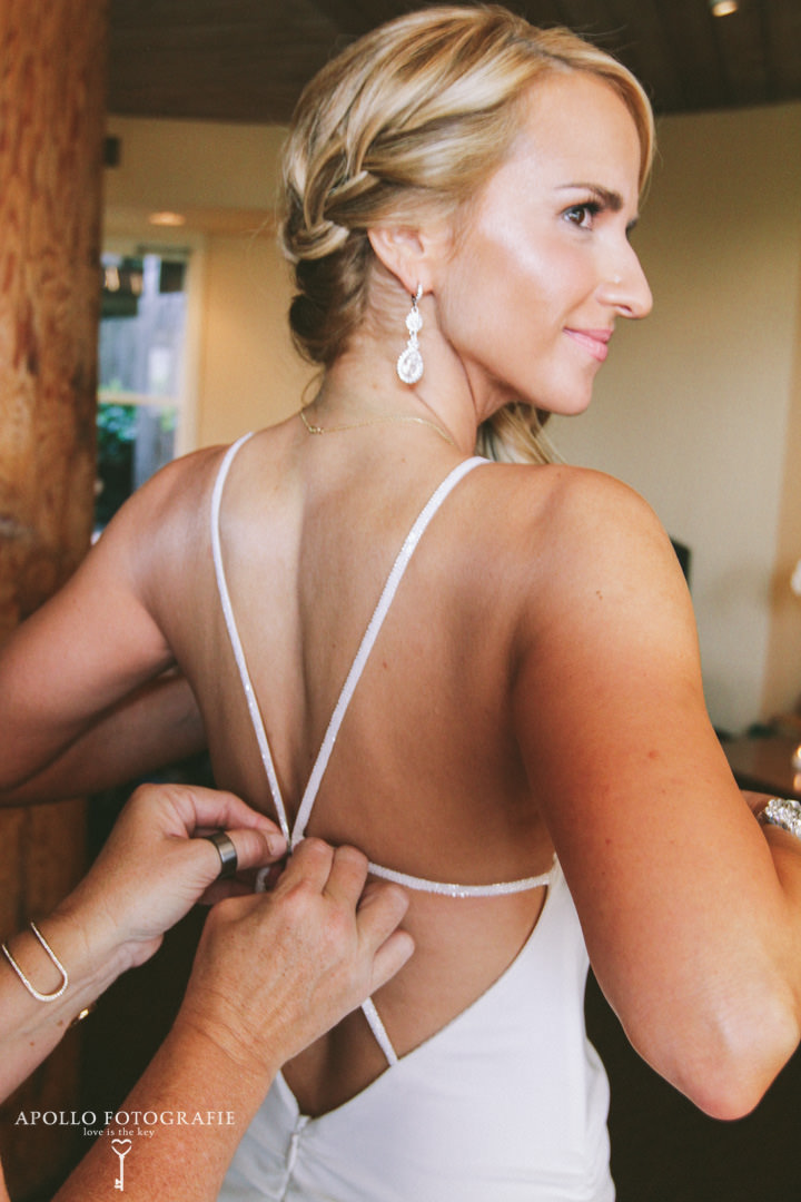bride getting into dress